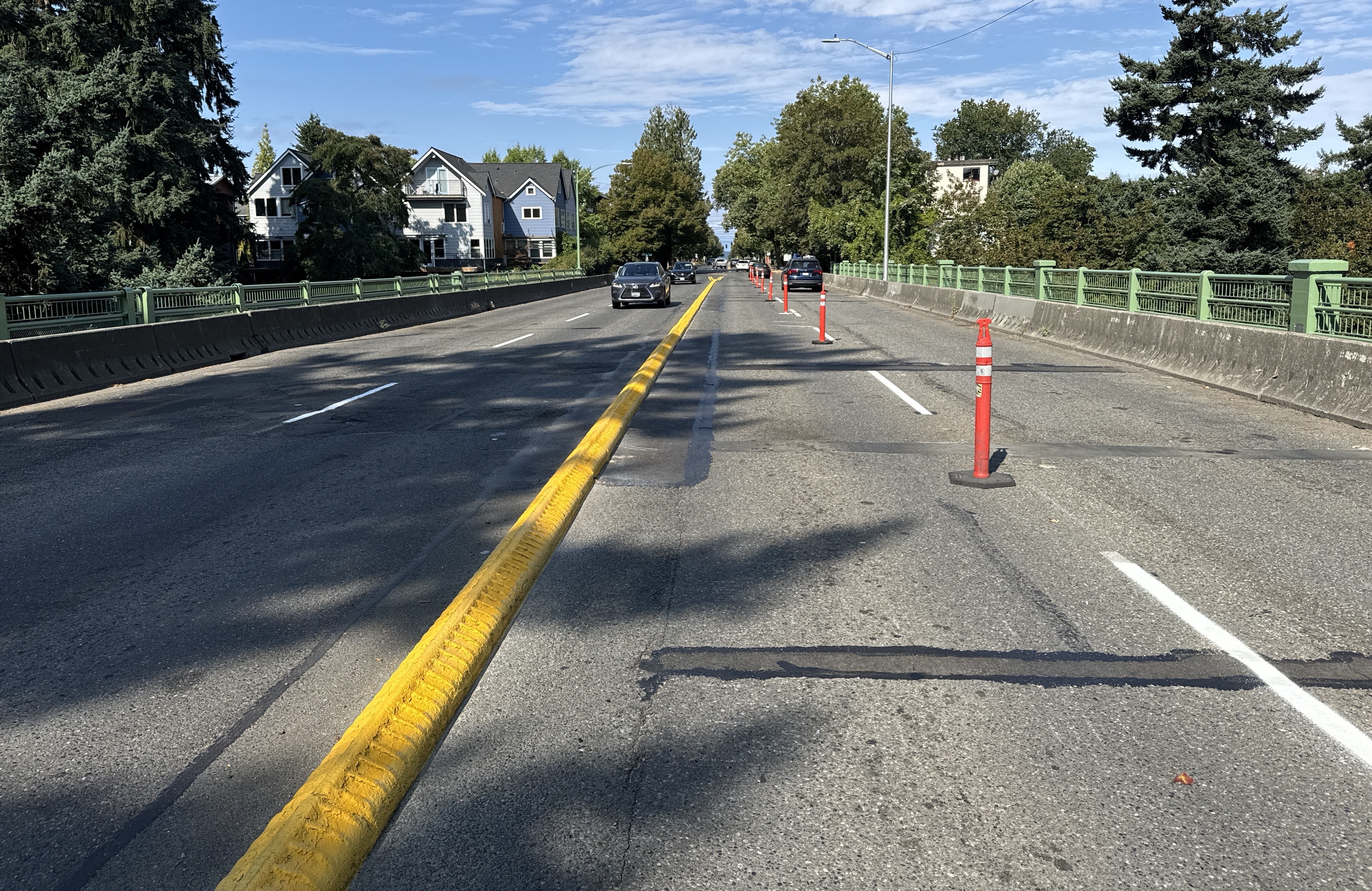 Admiral Way Bridges with yellow divider and orange candle poles still present in the right lane.