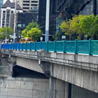 Guardrails that change from blue to green with the artwork design.